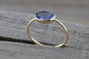 0.80 Carats Exotic Tanzanite is set on Solid 14k Yellow Gold Oval Bezel Band Ring - Brilliant Facets