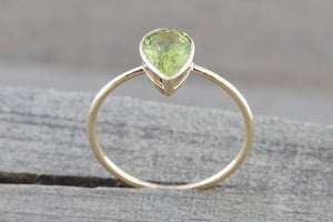 0.83 carats Green Peridot set on Solid 14k Yellow Gold Pear Shape Bezel Band Ring - Brilliant Facets