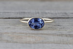 0.80 Carats Exotic Tanzanite is set on Solid 14k Yellow Gold Oval Bezel Band Ring - Brilliant Facets