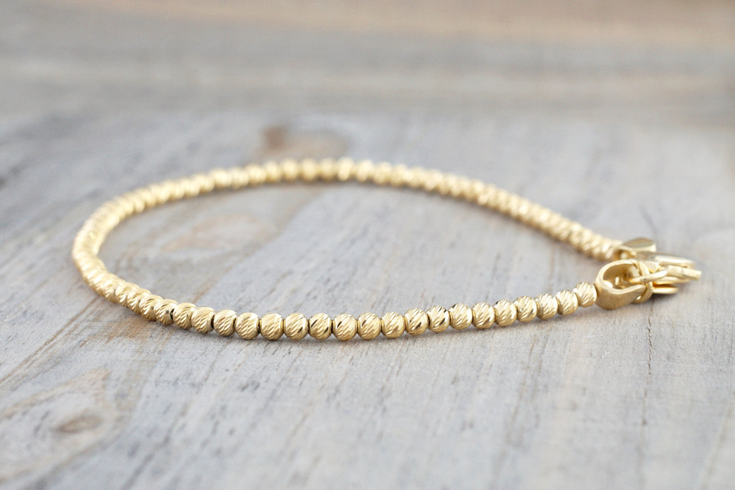 Amazon.com: 14k Gold Filled Beaded Ball Bracelet, 4mm, Dainty Layering  Jewelry, Stacking Stretch Bracelets (5.5): Clothing, Shoes & Jewelry
